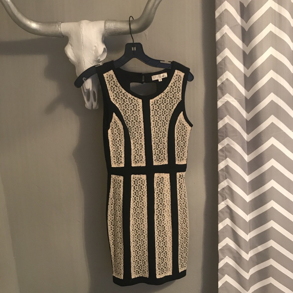 Perfect condition. Worn once. Open back. Black.